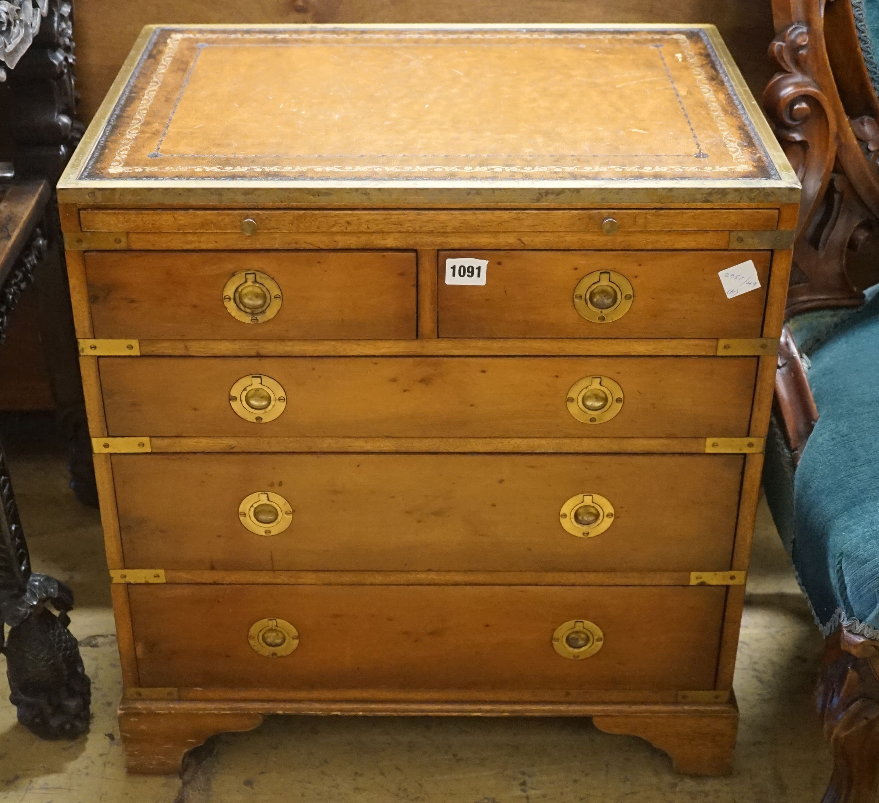 A pair of reproduction brass mounted military style yew veneered bedside chests with leather inset tops, width 56cm, depth 40cm, height 60cm